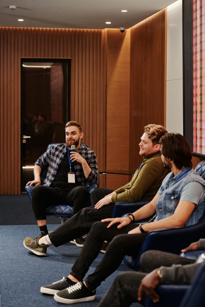 Web design professionals at a conference discussing digital strategies